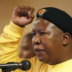 Suspended ANC Youth League President Julius Malema gestures as he sings during their annual conference in Pretoria