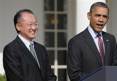 Dartmouth College president Jim Yong Kim (L) smiles as U.S. President Barack Obama 