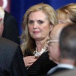 FILE - In this March 19, 2012, file photo, Ann Romney, wife of Republican presidential candidate, former Massachusetts Gov. Mitt Romney talks with audience members after her husbands spoke at the University of Chicago in Chicago. The spotlight on Ann Romney is getting brighter. Two out of three voters still don?t know the wife of the presumptive Republican presidential nominee. But her profile is growing as Mitt Romney moves into the general election against President Barack Obama. She was a stay-at-home mother of five boys. She bakes cookies. And, at 63, she has 16 grandchildren who call her "Mamie." But don?t be fooled: Republicans and Democrats alike see Ann Romney as an effective political weapon. (AP Photo/M. Spencer Green, File)