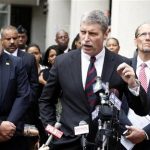 U.S. Attorney Jim Letten (C) speaks to the media after the sentencing of former New Orleans police officers who were convicted in deadly shootings New Orleans April 4, 2012. Five former police officers convicted for their roles in a post-Hurricane Katrina shootings that killed two unarmed civilians and wounded four others will be sentenced on Wednesday in federal court. REUTERS/Sean Gardner