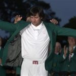 Bubba Watson of the U.S. receives his green jacket from 2011 champion Charl Schwartzel of South Africa after winning the 2012 Masters Golf Tournament at the Augusta National Golf Club in Augusta, Georgia, April 8, 2012. REUTERS/Mark Blinch