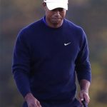 Tiger Woods of the U.S. walks off the 18th green after sinking a par putt during second round play in the 2012 Masters Golf Tournament at the Augusta National Golf Club in Augusta, Georgia, April 6, 2012. REUTERS/Phil Noble