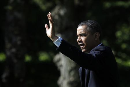 U.S. President Barack Obama waves as he walks out from the Oval Office of the White House in Washington May 10, 2012, before his departure to attend campaign events in Seattle and Los Angeles. REUTERS/Yuri Gripas