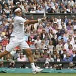 Roger Federer of Switzerland hits a return to Mikhail Youzhny of Russia during their men's quarter-final tennis match at the Wimbledon tennis championships in London July 4, 2012. REUTERS/Stefan Wermuth