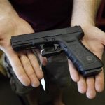 A Glock 22 pistol is seen at the Rocky Mountain Guns and Ammo store in Parker, Colorado July 24, 2012. REUTERS/Shannon Stapleton