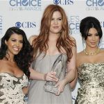 Reality television sisters (L-R) Kourtney, Khloe and Kim Kardashian pose with their favorite guilty pleasure award for 'Keeping Up with the Kardashians' at the 2011 People's Choice Awards in Los Angeles January 5, 2011 REUTERS/Danny Moloshok