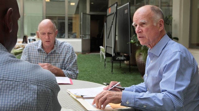 Gov.-Jerry-Brown-right-discusses-a-bill-with-Legislative-Affairs-Secretary-Gareth-Elliott-left-and-Legislative-Deputy-Brian-Putler-at-his-Capitol-office.