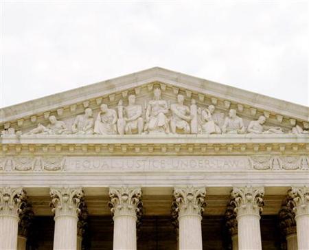 The front of the U.S. Supreme Court which reads 'Equal Justice Under Law' is seen in Washington July 19, 2005. UNICS REUTERS/Larry Downing