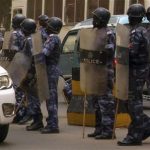 A line of police personnel holding batons and shields in Khartoum June 11, 2011. REUTERS/Stringer