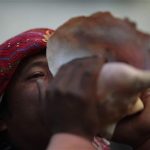 Mayan priest Carlos Tun blows a conch shell horn during the pre-Hispanic mass of "Segunda Conexion" (Second Connection) to commemorate the 13th bak'tun, an epoch lasting roughly 400 years, outside the Chi Ixim church in Tactic, Alta Verapaz region, December 20, 2012. On December 21, an era closes in the Maya Long Count calendar, an event that has been likened by different groups to the end of days, the start of a new, more spiritual age or a good reason to hang out at old Maya temples across Mexico and Central America. The Chi Ixim church is a sacred Mayan site. REUTERS/Jorge Dan Lopez