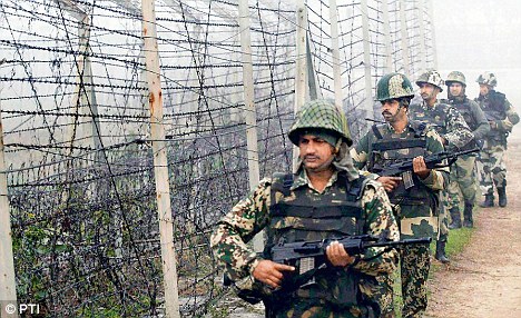 Border Security Force soldiers patrol along the India-Pakistan border in Suchitgarh near Jammu.