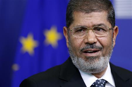 Egypt's President Mohamed Mursi answers reporters' questions after meeting European Commission President Jose Manuel Barroso (unseen) at the EU Commission headquarters in Brussels September 13, 2012. REUTERS/Francois Lenoir