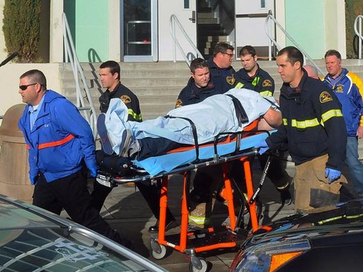 This image provided by the Taft Midway Driller/Doug Keeler shows paramedics assisting a student wounded during a shooting Thursday Jan. 10, 2013 at San Joaquin Valley high school in Taft, Calif. Authorities said a student was shot and wounded and another student was taken into custody. 