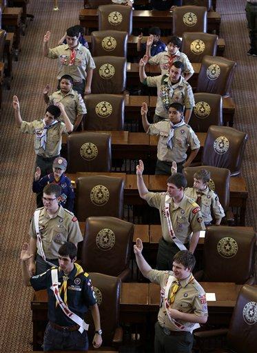 FILE - In this Feb. 2, 2013 file photo, Boy Scouts recite the Scout Oath during the annual Boy Scouts Parade and Report to State in the House Chambers at the Texas capitol, in Austin, Texas. President Barack Obama said Sunday, Feb. 3, 2013 that gays should be allowed in the Boy Scouts and women should be allowed in military combat roles. (AP Photo/Eric Gay, File)