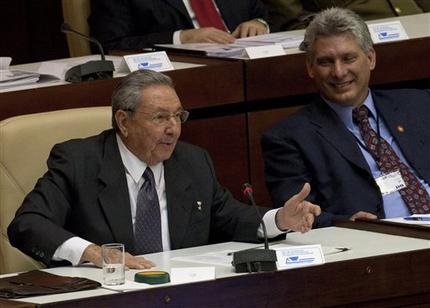 Cuba's new Vice-President Miguel Diaz-Canel, right, listens to Cuba's President Raul Castro during the closing session at the National Assembly in Havana, Cuba, Sunday, Feb. 24, 2012.  Raul Castro accepted a new five-year term that will be, he said, his last as Cuba's president and tapped rising star Miguel Diaz-Canel, 52, as vice-president and first in the line of succession. Diaz-Canel has risen higher than any other Cuban official who didn't directly participate in the 1959 Cuban revolution. At center Cuba's Minister of Foreign Affairs Bruno Rodriguez.(AP Photo/Ramon Espinosa)