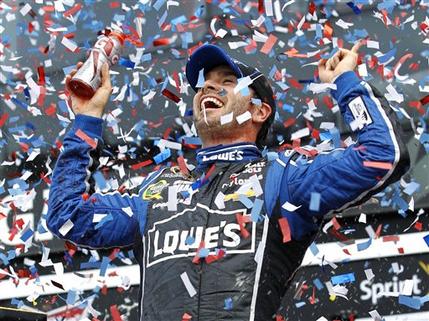 Jimmie Johnson celebrates after winning the Daytona 500 NASCAR Sprint Cup Series auto race, Sunday, Feb. 24, 2013, at Daytona International Speedway in Daytona Beach, Fla. (AP Photo/Terry Renna)