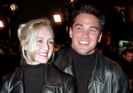 Actor Dean Cain escorts his girlfriend, country music singer Mindy McCready, to the premiere of the new horror film "Scream 2" at Mann's Chinese Theatre in Hollywood, California in this December 10, 1997 file photograph. McCready has died aged 37 from an apparently self-inflicted gunshot wound, an Arkansas sheriff said on February 17, 2013. REUTERS/Fred Prouser/Files