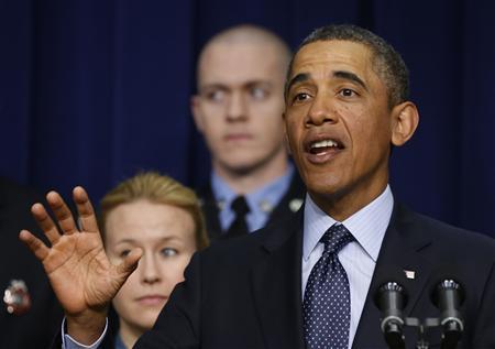 U.S. President Barack Obama talks against automatic budget cuts scheduled to take effect next week, while in the South Court Auditorium in the Eisenhower Executive Office Building in the White House complex in Washington February 19, 2013. REUTERS/Larry Downing