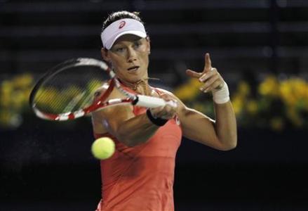 Samantha Stosur of Australia hits a return to Ekaterina Makarova of Russia during their women's singles match at the WTA Dubai Tennis Championships, February 19, 2013. REUTERS/Jumana El Heloueh