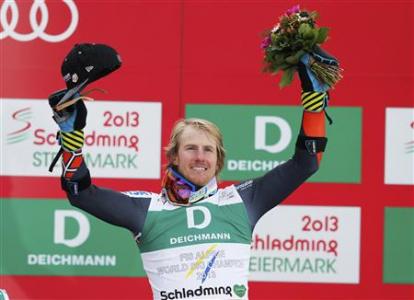 First placed Ted Ligety of the U.S. celebrates on the podium during the flower ceremony after the men's Giant Slalom race at the World Alpine Skiing Championships in Schladming February 15, 2013. REUTERS/Leonhard Foeger