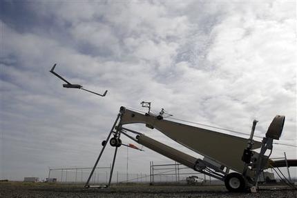 This photo taken March 26, 2013, shows an Insitu ScanEagle unmanned aircraft launched at the airport in Arlington, Ore.  Its a good bet that in the not-so-distant future aerial drones will be part of Americans everyday lives, performing countless useful functions. A far cry from the killing machines whose missiles incinerate terrorists, these generally small unmanned aircraft will help farmers more precisely apply water and pesticides to crops, saving money and reducing environmental impacts. Theyll help police departments to find missing people, reconstruct traffic accidents and act as lookouts for SWAT teams. Theyll alert authorities to people stranded on rooftops by hurricanes, and monitor evacuation flows.  (AP Photo/Don Ryan)