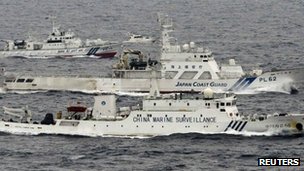 Japan PM Abe warns China of force over islands landing