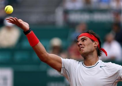 Rafael Nadal of Spain serves to Grigor Dimitrov of Bulgaria during the Monte Carlo Masters in Monaco April 19, 2013. REUTERS/Eric Gaillard