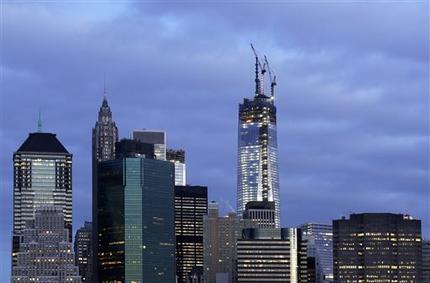 FILE - One World Trade Center rises above the lower Manhattan skyline,  April 13, 2013 in New York. It is already New Yorks tallest building. But when the last pieces of its spire go up to the roof Monday, April 28, the 104-floor skyscraper will be one step away from becoming the highest in the Western Hemisphere. (AP Photo/Mark Lennihan, File)