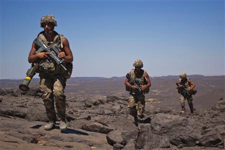 French soldiers patrol in the Terz valley, about 60 km (37 miles) south of the town of Tessalit in northern Mali March 20, 2013. REUTERS/Francois Rihouay