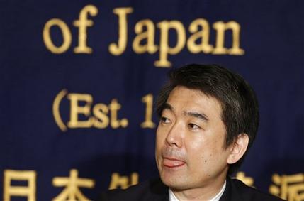 Osaka Mayor Toru Hashimoto listens to a reporter's question during a press conference at the Foreign Correspondents' Club of Japan in Tokyo Monday, May 27, 2013. The outspoken Japanese politician apologized Monday for saying U.S. troops should patronize adult entertainment businesses as a way to reduce rapes, but defended another controversial remark about Japan's use of sex slaves during World War II. (AP Photo/Shizuo Kambayashi)