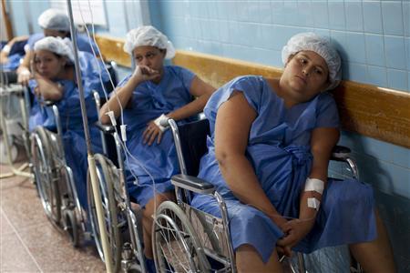 Pregnant women wait for their turn to undergo a Cesarean section (c-section) procedure at the Santa Ana public maternity hospital in Caracas October 19, 2011. REUTERS/Carlos Garcia Rawlins