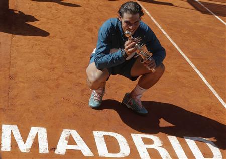 Rafael Nadal of Spain poses with the Ion Tiriac's trophy after winning the Madrid Open final tennis match against Stanislas Wawrinka of Switzerland in Madrid, May 12, 2013. REUTERS/Juan Medina