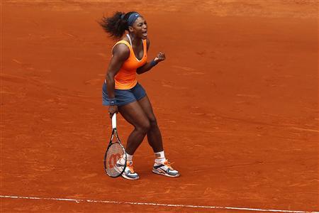 Serena Williams of the U.S. celebrates her victory against Lourdes Dominguez Lino of Spain during their women's singles match at the Madrid Open tennis tournament, May 7, 2013. REUTERS/Juan Medina