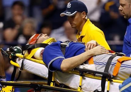 Toronto Blue Jays' J.A. Happ is attended to by medical personnel as he is taken off the field on a stretcher after being hit in the head by a line drive by Tampa Bay Rays' Desmond Jennings during the second inning of a baseball game Tuesday, May 7, 2013, in St. Petersburg, Fla. (AP Photo/Mike Carlson)