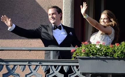 Christopher O'Neill, from the US,  left, and Swedish Princess Madeleine, right, wave from the balcony of the Grand Hotel in Stockholm, Sweden, Friday June 7, 2013, prior to a dinner for the couple at the hotel, the day before their wedding.  Three years ago she crossed the Atlantic with a broken heart. Now Sweden's "party princess" returns from New York to Stockholm to tie the knot with her new, British-American love. On Saturday, Princess Madeleine  the Duchess of Halsingland and Gastrikland  will wed New York banker Christopher O'Neill in the Swedish capital, bringing together European royals and top New York socialites for a grand celebration. (AP Photo/Scanpix Sweden/Bertil Enevag Ericson)  SWEDEN OUT