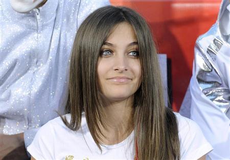 Michael Jackson's daughter Paris attends a ceremony where the singer's shoes and gloves are used to make hand and foot imprints in cement in the courtyard of Hollywood's Grauman's Chinese Theatre in Los Angeles on January 26, 2012. REUTERS/Phil McCarten