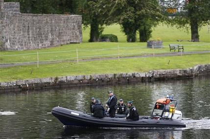 Police patrol the water around the G8 summit venue in Enniskillen, Northern Ireland on Sunday, June 16, 2013. In a two-day meeting, beginning on Monday, global leaders will discuss the economy and exchange views on foreign affairs and security issues. (AP Photo/Lefteris Pitarakis)