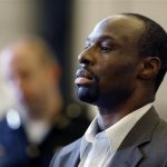 Ricardo Woods stands in front of Judge Beth Myers with his attorney as he is sentenced, Thursday, June 20, 2013 in Cincinnati. Ricardo Woods, 35, was sentenced Thursday to 36 years to life in prison for the murder of David Chandler and for felonious assaults and weapons charges. The murder trial drew national attention when the judge allowed jurors to see a police interview of Chandler two weeks before his death during which he blinked in response to questions about who shot him. (AP Photo/The Cincinnati Enquirer, Carrie Cochran) MANDATORY CREDIT; NO SALES