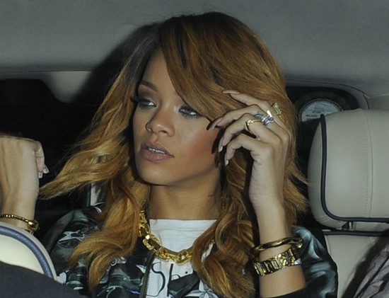 Rihanna is bundled into a car following her night out (Splash News)