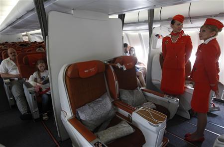 People sit onboard an Aeroflot Airbus A330 heading to the Cuban capital Havana at Moscow's Sheremetyevo airport June 27, 2013. REUTERS/Maxim Shemetov