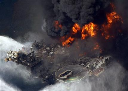 FILE - In this April 21, 2010 file aerial photo, the Deepwater Horizon oil rig burns in the Gulf of Mexico more than 50 miles southeast of Venice, La. A lawyer working for the court-appointed administrator to review claims as part of the multibillion-dollar settlement over BP's Gulf oil spill has been accused of receiving payments from a law firm representing a claimant, allegations that were discussed in a closed-door meeting Thursday, June 20, 2013, with a federal judge overseeing the case, a BP official with direct knowledge of the situation told The Associated Press. (AP Photo/Gerald Herbert, File)