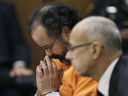 Ariel Castro looks down during court proceedings Friday, July 26, 2013, in Cleveland. Castro, who imprisoned three women in his home, subjecting them to a decade of rapes and beatings, pleaded guilty Friday to 937 counts in a deal to avoid the death penalty. Defense attorney Jaye Schlachet is on the right. (AP Photo/Tony Dejak)