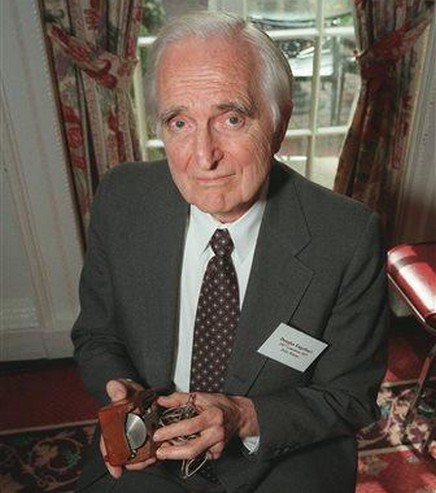 FILE - In this April 9, 1997 file photo, Doug Engelbart, inventor of the computer mouse and winner of the half-million dollar 1997 Lemelson-MIT prize, poses with the computer mouse he designed, in New York. Engelbart has died at the age of 88. The cause of death wasn't immediately known. (AP Photo/Michael Schmelling, File)