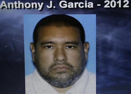 Dr. Anthony Garcia, 40, is pictured in this photo released by the Omaha Police. Omaha Police Chief Todd Schmaderer said that Garcia was arrested Monday, July 15, 2013, in Illinois. Garcia has been linked to both the May 2013 Omaha slayings of 65-year-old Roger Brumback and 65-year-old Mary Brumback and the 2008 stabbing deaths of an 11-year-old Thomas Hunter and his family housekeeper, 57-year-old Shirlee Sherman. The slain Brumback and Hunter fired Garcia in 2001 when he was a pathology resident at Creighton Medical School. (AP Photo/Omaha Police)