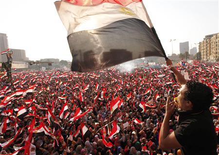 Protesters against Egyptian President Mohamed Mursi wave national flags in Tahrir Square in Cairo July 3, 2013. REUTERS/Mohamed Abd El Ghany