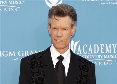 Singer Randy Travis arrives at the 45th annual Academy of Country Music Awards in Las Vegas, Nevada in this April 18, 2010 file photo. y to relieve pressure on his brain. He is in critical condition, according to a family spokesman. REUTERS/Steve Marcus/Files