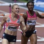 Sally Pearson (L) of Australia reacts next to third-placed Kellie Wells of the United States after winning the women's 100m hurdles at the London Diamond League 'Anniversary Games' athletics meeting in east London July 27, 2013. REUTERS/Paul Hackett