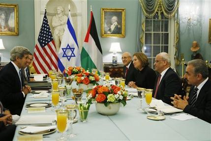 Secretary of State John Kerry, left, sits across from Israel's Justice Minister and chief negotiator Tzipi Livni, third right, Palestinian chief negotiator Saeb Erekat, second right, Yitzhak Molcho, an adviser to Israeli Prime Minister Benjamin Netanyahu, fourth right, and Mohammed Shtayyeh, aide to Palestinian President Mahmoud Abbas, right, at an Iftar dinner, which celebrates Ramadan, at the State Department in Washington, marking the resumption of Israeli-Palestinian peace talks, Monday, July 29, 2013. (AP Photo/Charles Dharapak)