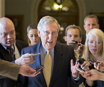 Senate Republican Leader Mitch McConnell of Kentucky is surrounded by reporters as he returns to his office after meeting with Senate Majority Leader Harry Reid, D-Nev., at the Capitol in Washington, Monday, July 15, 2013. The Senate Democrats that make up the majority and the Republicans that comprise the minority are gathering in a rare closed-door meeting in the Old Senate Chamber for a showdown over presidential nominees that have been blocked by a GOP filibuster. (AP Photo/J. Scott Applewhite)