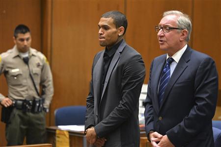 Singer Chris Brown and attorney Mark Geragos (R) attend a probation progress hearing in Los Angeles Superior Court July 15, 2013. REUTERS/Alberto E. Rodriguez/Pool